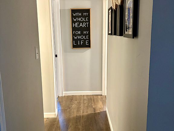 Hallway to two bedrooms and bathroom