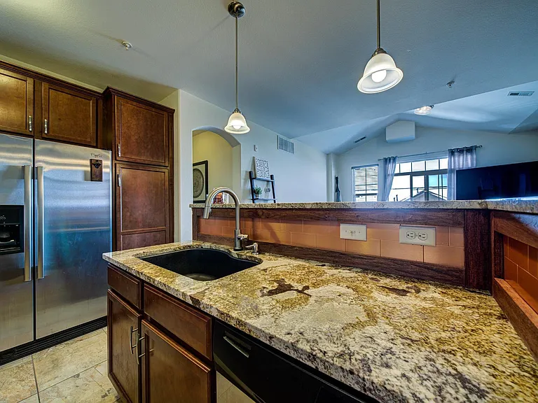 Extra large black kitchen sink.