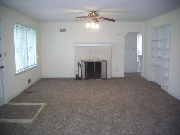 Living Room w/ Ceiling Fan & Fireplace