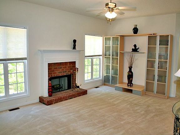Family Room w/Fireplace Opens to Gourmet Kitchen and Rear Deck