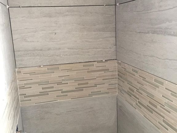 Wrapping up the final details of shower.