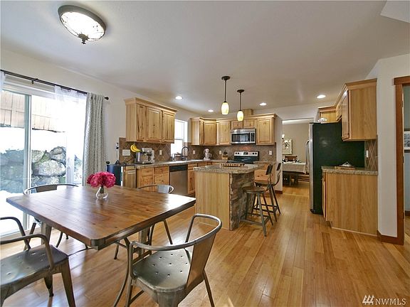 Great big kitchen with breakfast nook and island counter.