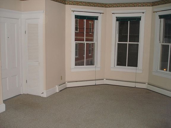Living Room with closet & bay windows