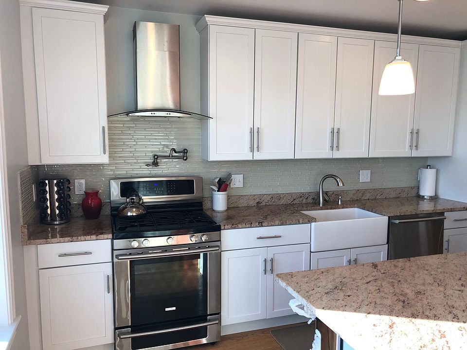 Kitchen with stainless steel appliances & farmers sink