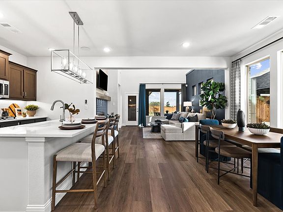 Highfield floor plan by Pacesetter Homes featuring a two-story layout with a first-floor primary sui