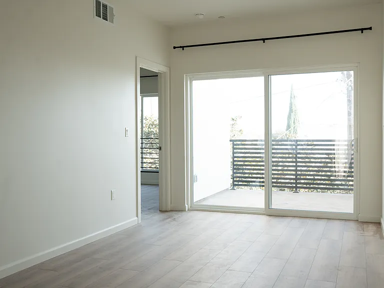 3rd Level Living Area + Private Balcony