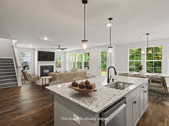 Kitchen Island/Living Room 
(AI generated staged)