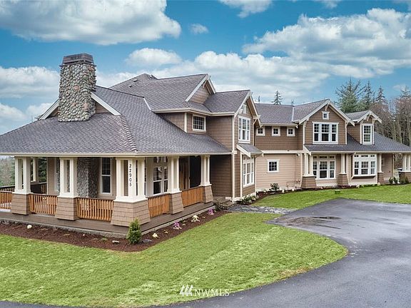 4600 Square feet of luxury details in this custom Craftsman home featuring a new composite wrap around porch and back deck (not shown).