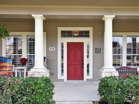 Notice the transom and sidelights surrounding the front door. The windows have double pane and all have plantation shutters.