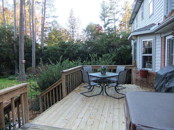 Private back yard and deck with hot tub.
