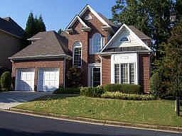 Front of home 3-sides brick