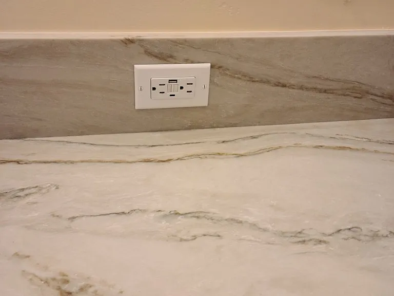 USB power plug in master bathroom backsplash