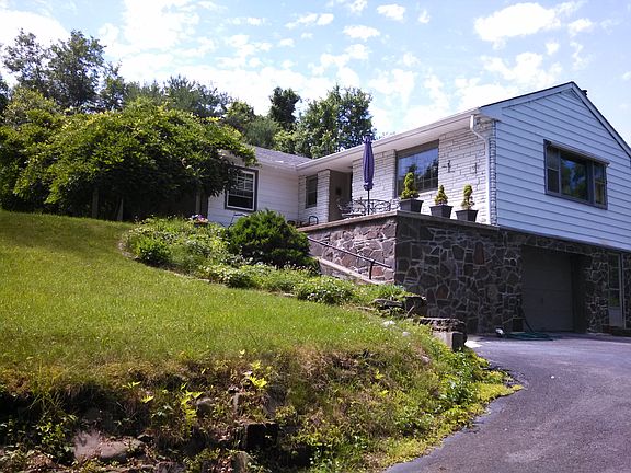 side with garage and patio