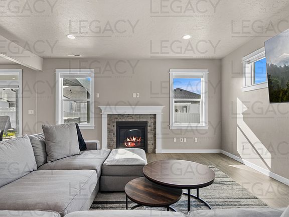 Main living space with fireplace and prewire for TV