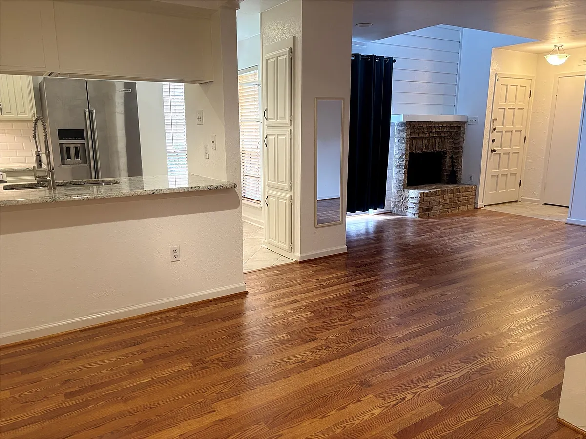 New floors!Updated kitchen is open to dining area. Sliding glass door to front enclosed patio. - 5626 Preston Oaks Rd #5A