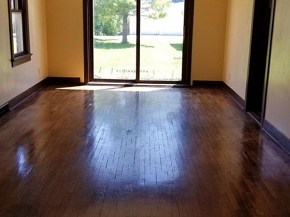 Patio doors leading to backyard and garage.