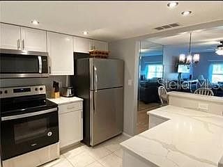 4th image of 4650 Cove Cir APT 210