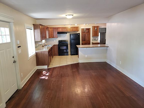Front door view of kitchen and part of living room