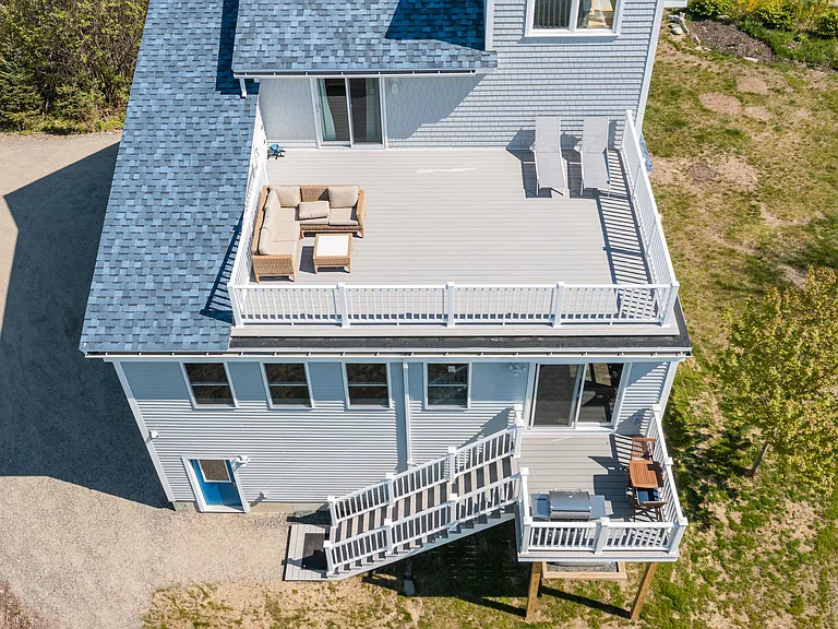 the 3rd floor sunbathing deck overlooking the ocean and the 2nd floor deck for grilling and dining.