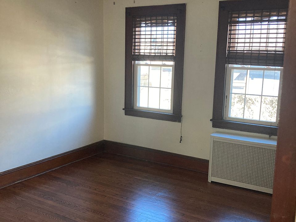 Spacious and Bright Bedroom #2 with hardwoods floors and a ceiling fan.