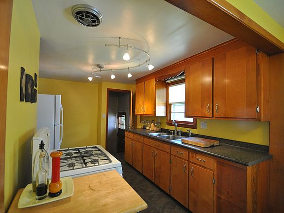 Updated kitchen. New tile, countertops, high end sink, fixtures, lighting. New