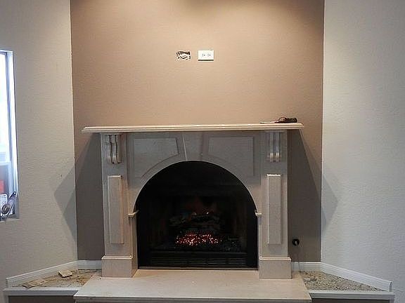 New marble mantle + tv/cable