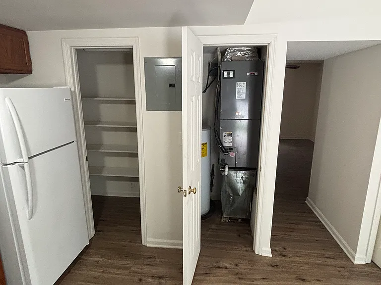 Small closet in the kitchen that holds the water heater and hvac