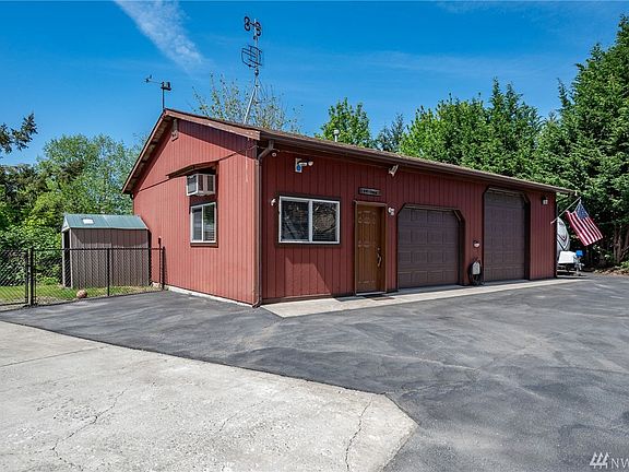 This incredible garage is ready for car maintenance, dance parties and movie nights. You have to see it to believe it. Video surveillance keeps an eye on things. Also here are 2 of the 5 sheds.