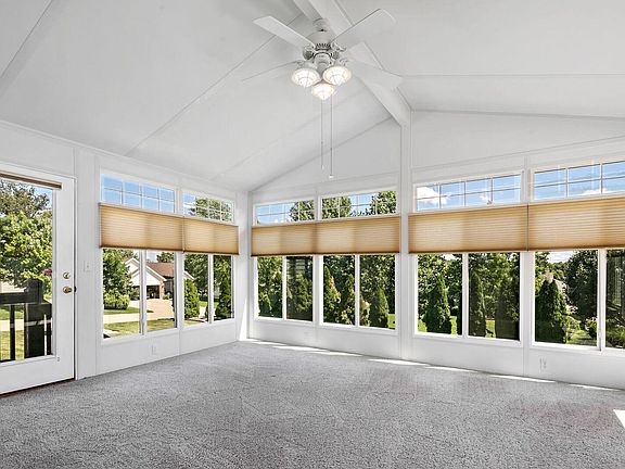 Beautiful 3 season room has vaulted ceiling, fan and separate a/c
