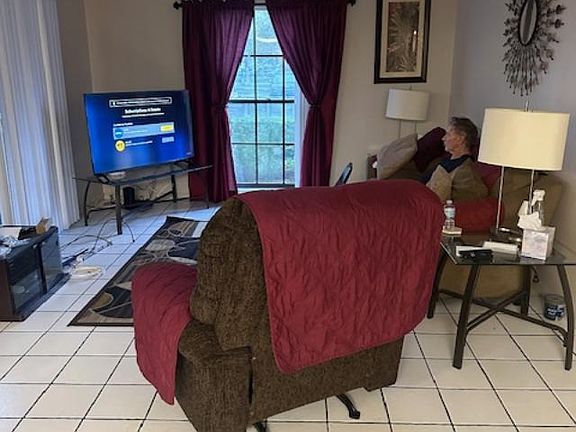 Furnished living room with new 55 inch roku tv.
