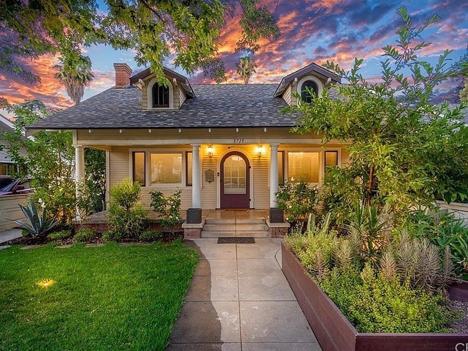 Beautiful front yard with porch and mature landscaping