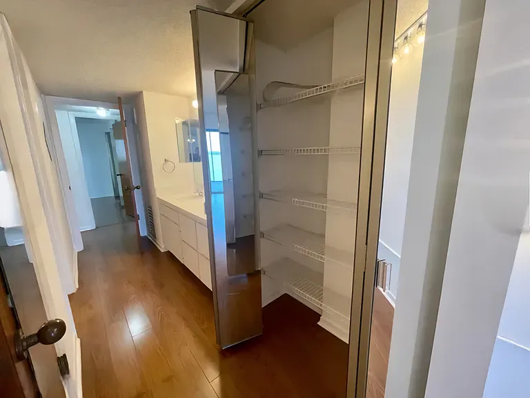 Separate Vanity and storage off Master Bedroom besides the connecting Master Bathroom.