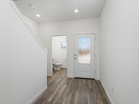 The foyer leads straight to the living room as well as the staircase.