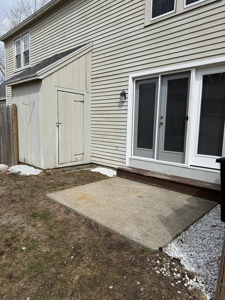 A small patio in the back with a little storage - 139 Broadway #13