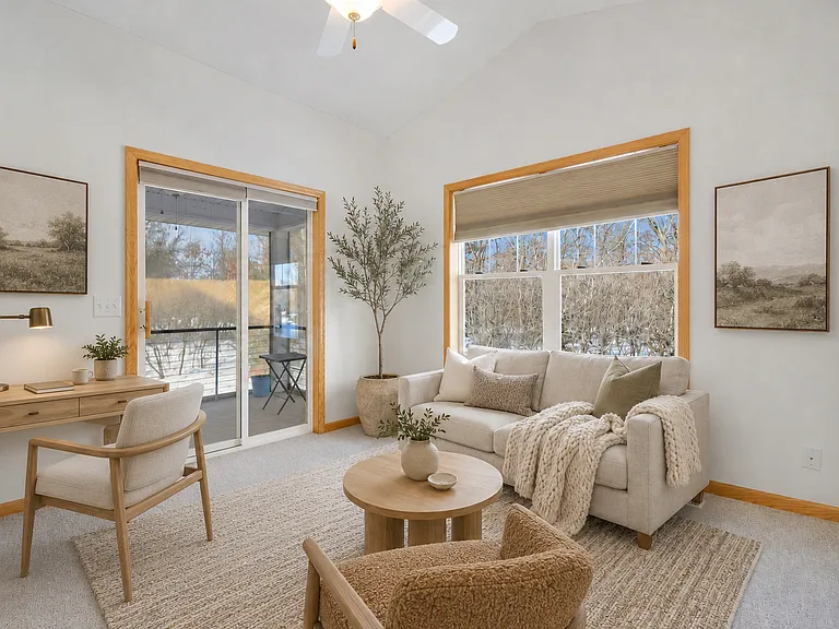 Versatile porch space that opens to the screened deck.