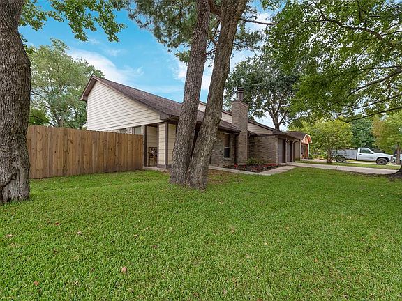 Huge front yard with mature trees, great for shade. Roof replaced 5/19