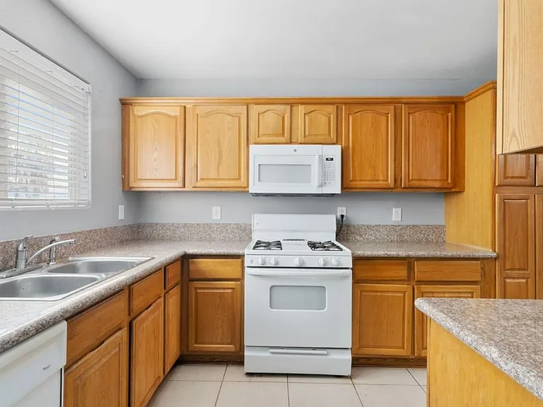 Large Renovated 3-Bed/2.5-Bath Townhomes at a Great Price with Covered Parking Included — Photo 27