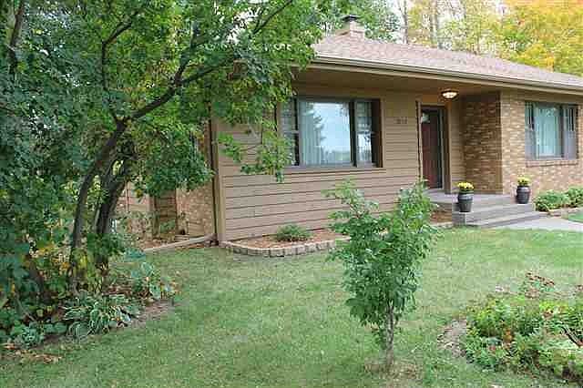 Brick ranch with cedar accents, new roof, new cedar soffits