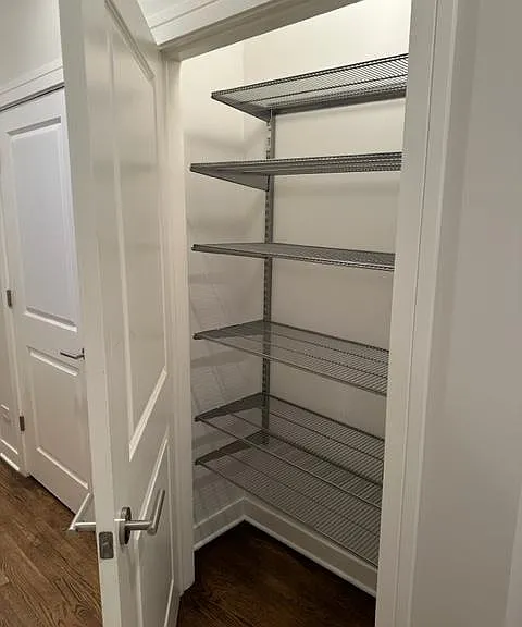 Entrance hall closet. One of three