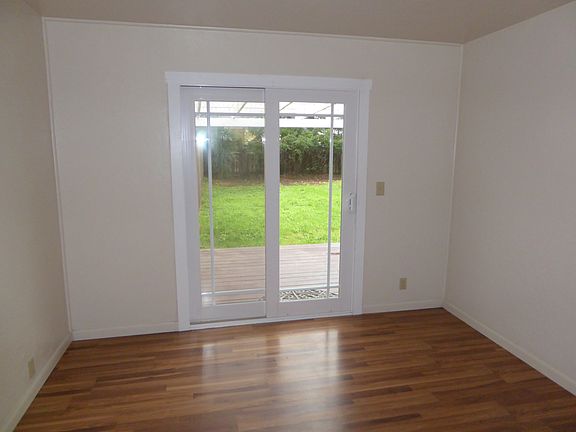 Master bedroom with entry to backyard and deck