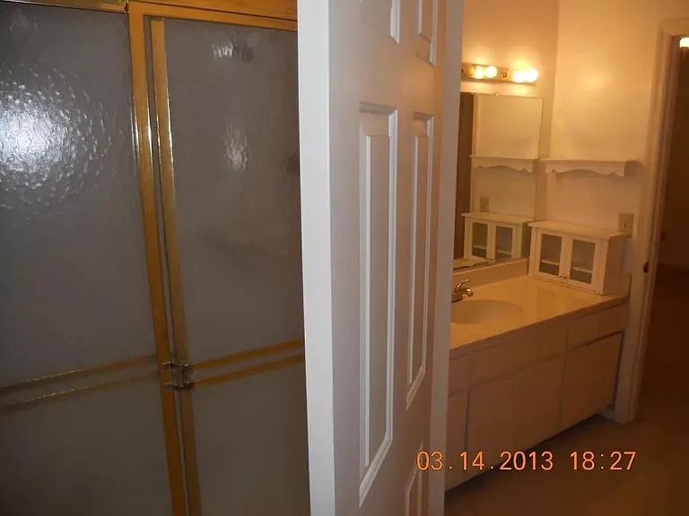 master bedroom with full bath and laundry