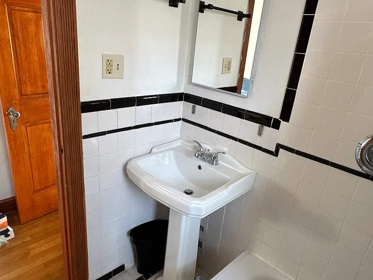 new sink, medicine cabinet, lights, and towel racks