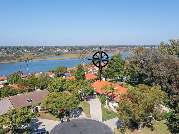 Take a deep breath as you live in a park-like environment near Newport Back Bay.