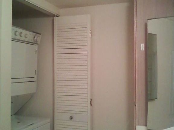 Bathroom view of washer and dryer