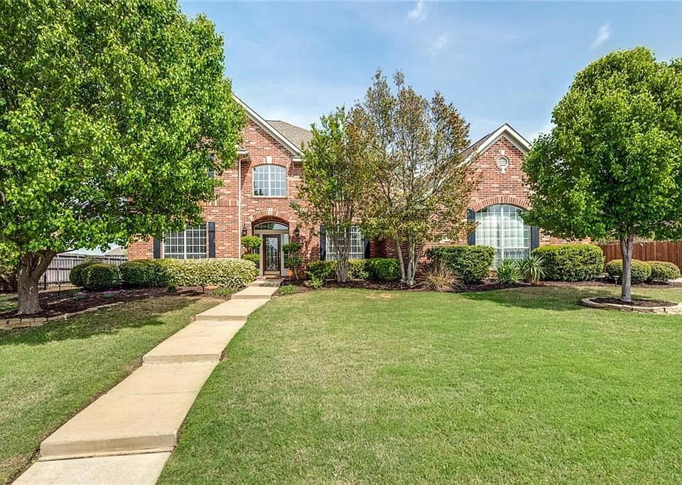Nestled within a fabulous neighborhood in highly desirable north Keller, this home is seated and on a half acre beautifully landscaped lot that includes an inground pool.