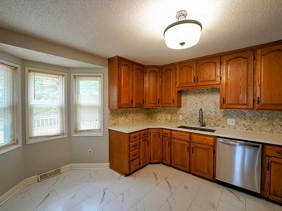 Kitchen with all new stainless steel appliances.