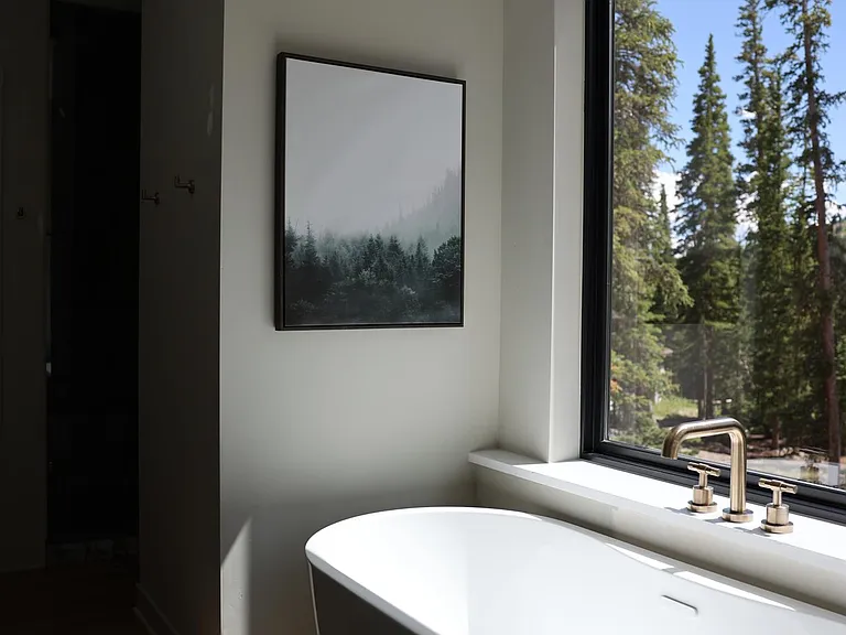 Soaking tub with incredible views in primary bath.