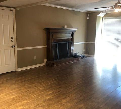 Fireplace w/gas logs. Entrance to garage