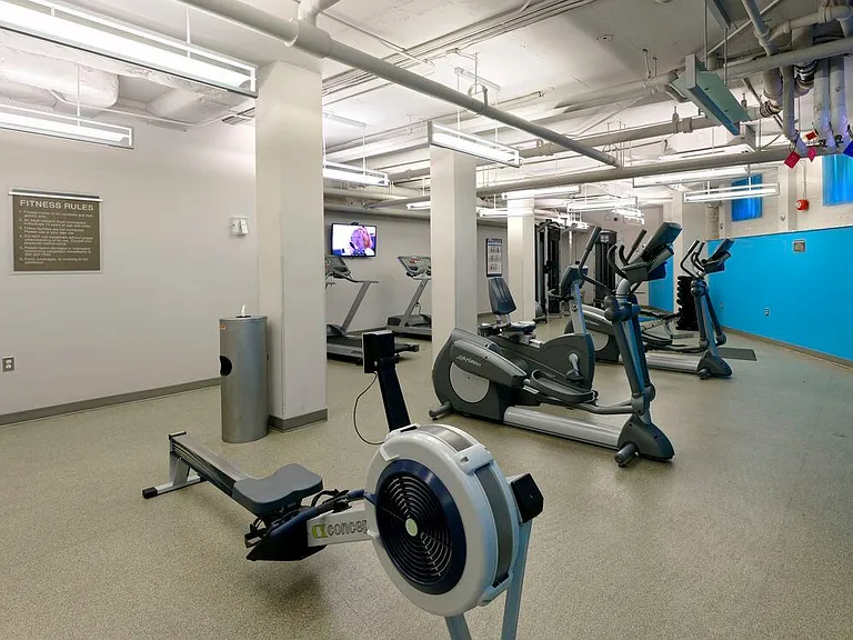 Fitness center with cardio equipment and flat screen televisions