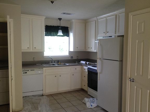 Kitchen with all appliances (now has new stainless steel 2 door refrigerator with ice and water on door. Dishwasher, oven-range combination and private hot water heater (some storage under water heater-closet on the right in this picture.